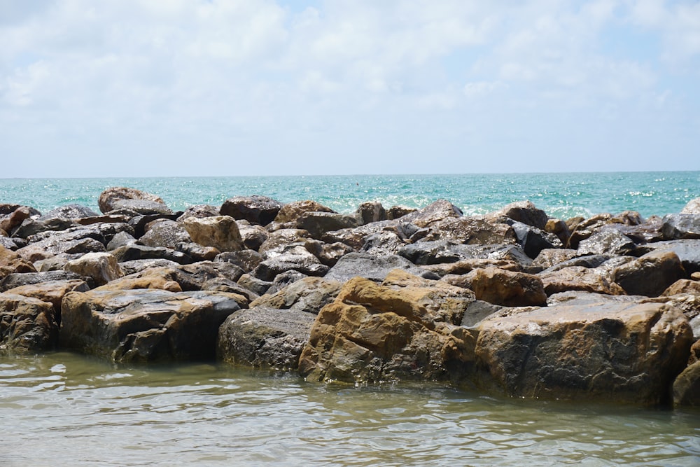 a bunch of rocks that are in the water