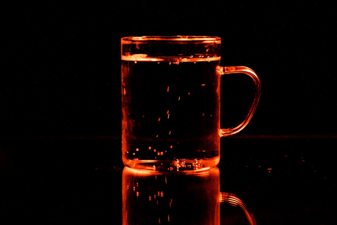 clear glass mug with water