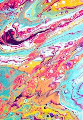 A vibrant abstract painting with flowing colors and shapes.
