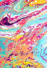 A vibrant abstract painting with swirling patterns and flowing lines in bright, bold colors. There are dynamic fluid shapes and a marbled effect, creating a sense of movement and energy.