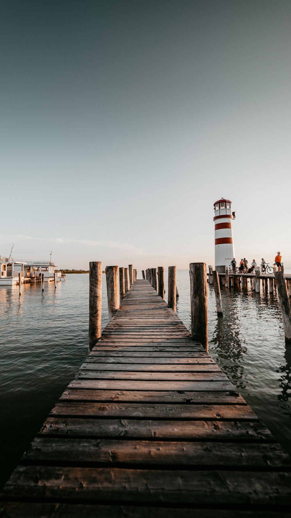 brown wooden dock on body of water during daytime