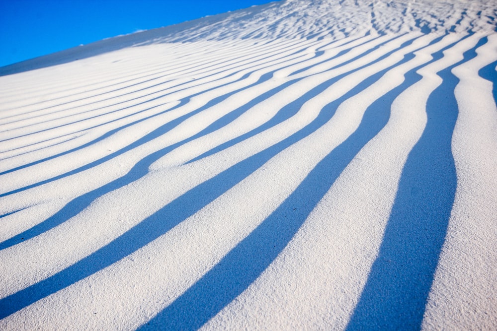 white sand under blue sky during daytime