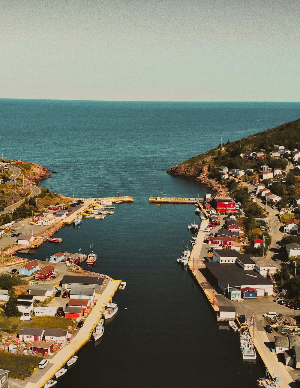 aerial view of city near body of water during daytime