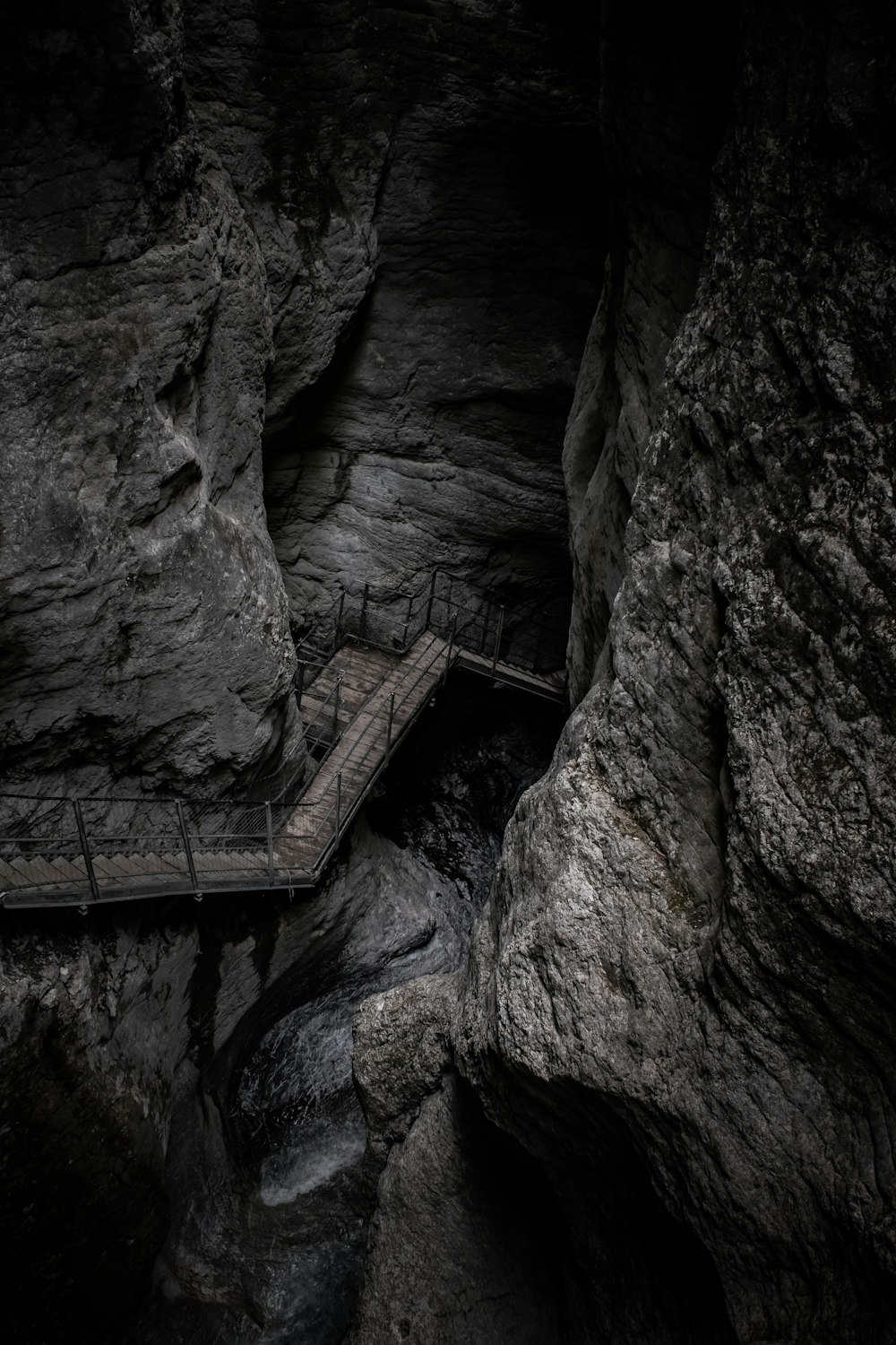 brown wooden ladder on rocky mountain