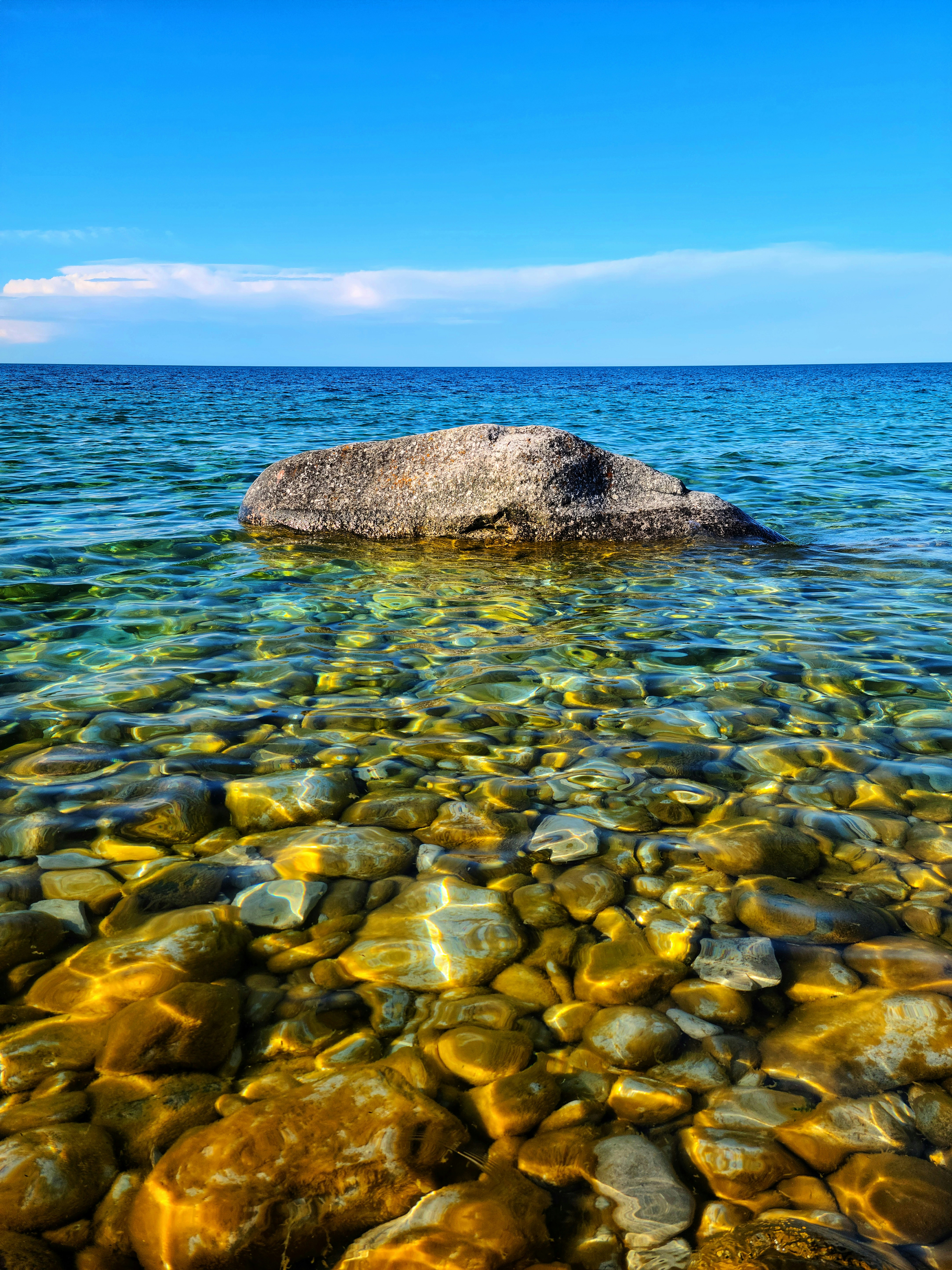 Brown rock on body of water during daytime photo – Free Beach Image on ...