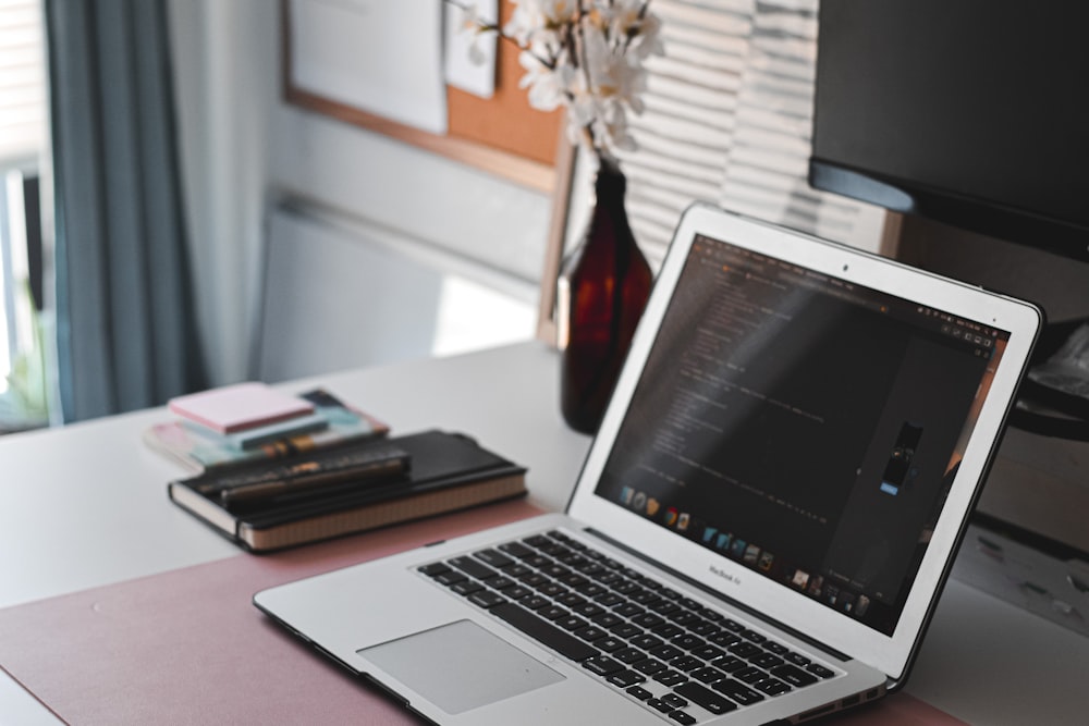 macbook air on brown wooden table