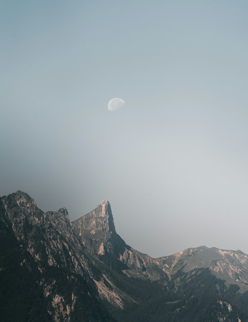 brown rocky mountain under white sky during daytime