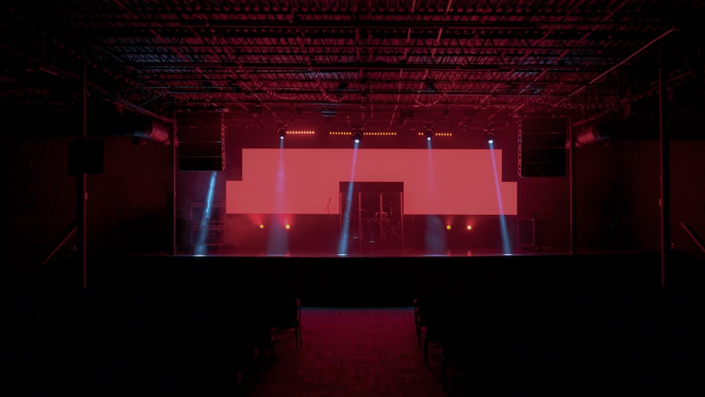 red and black stage with red lights