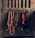 A collection of horse tack, including bridles and ropes, hangs neatly from hooks on a wooden wall. Each item varies in color and texture, with some made of leather and others of rope.
