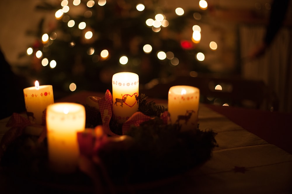 white candles on brown wooden table