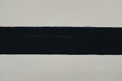 black textile on white surface