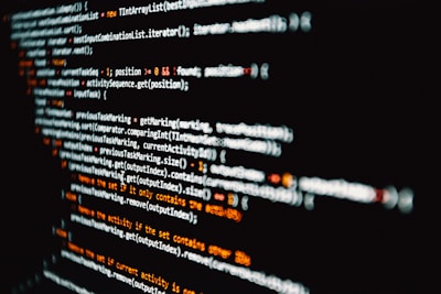 close up image of a black computer screen with lines of programming codes.