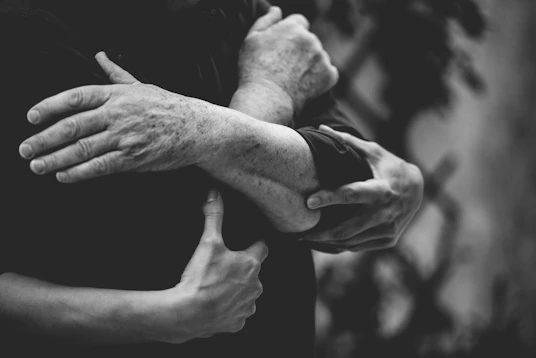 a couple of people that are hugging each other