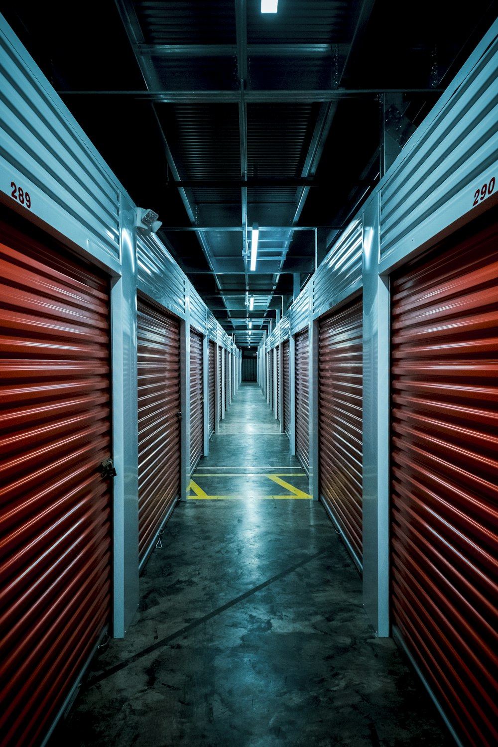 red and gray tunnel with red metal wall