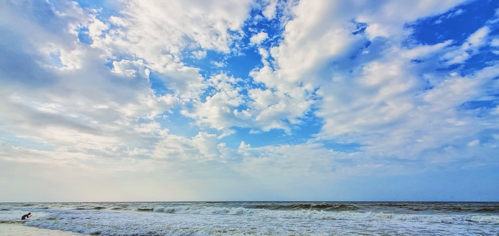 blue sky and white clouds over sea