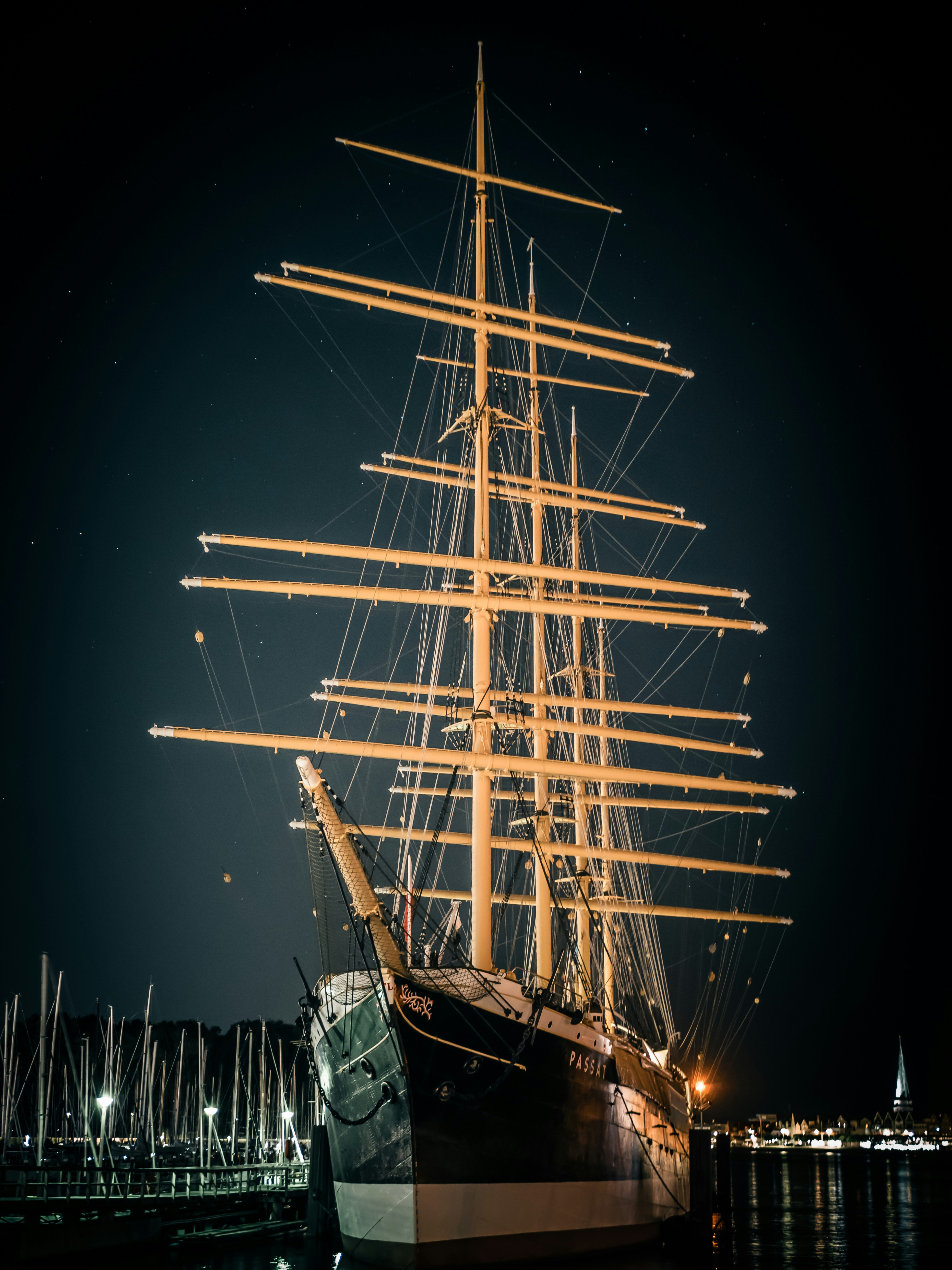 black and white ship on sea during night time