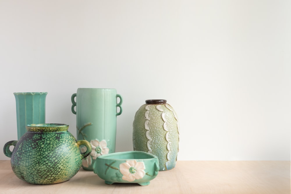 white and green ceramic floral mugs