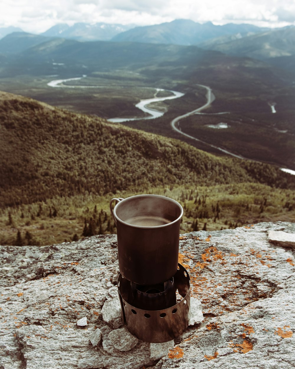 brown and black metal tank on brown rocky mountain during daytime