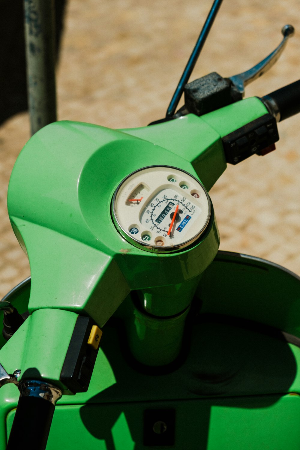 green motorcycle with white gauge