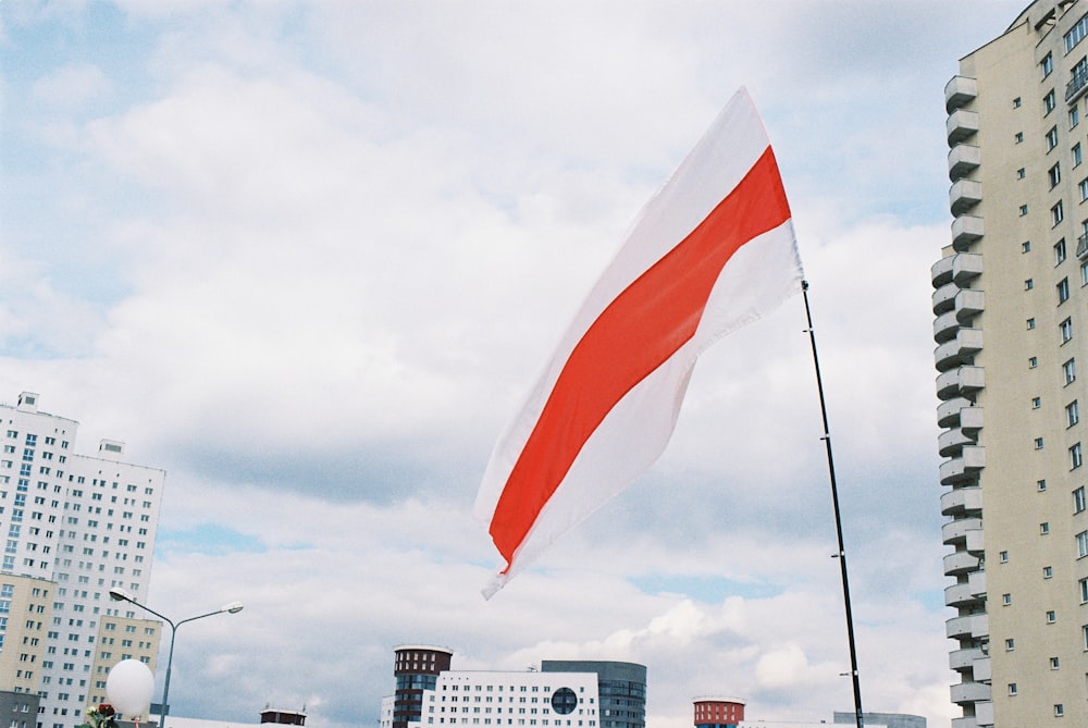 red and yellow flag on pole during daytime