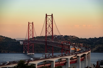 red bridge over the river during daytime