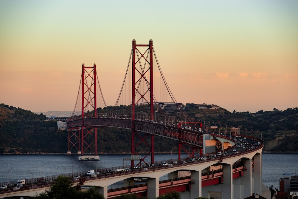 red bridge over the river during daytime