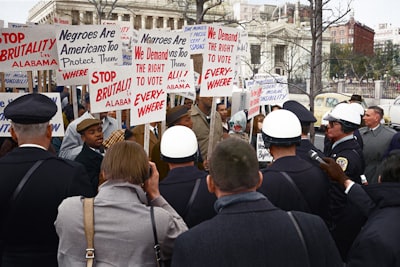 african american demonstrators outside the white house, with signs demanding the right to vote and protesting police brutality against civil rights demonstrators in selma, alabama colorized zoom background