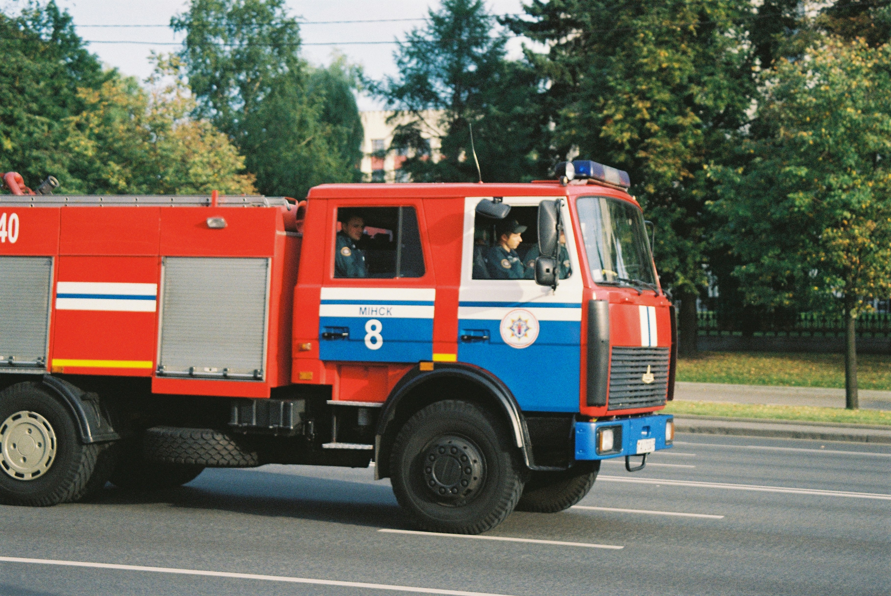 red and blue bus on road during daytime