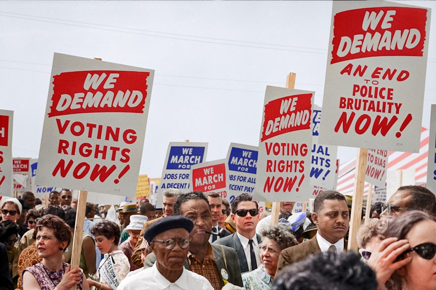 Marchers with signs at the March on Washington, 1963, colorized
