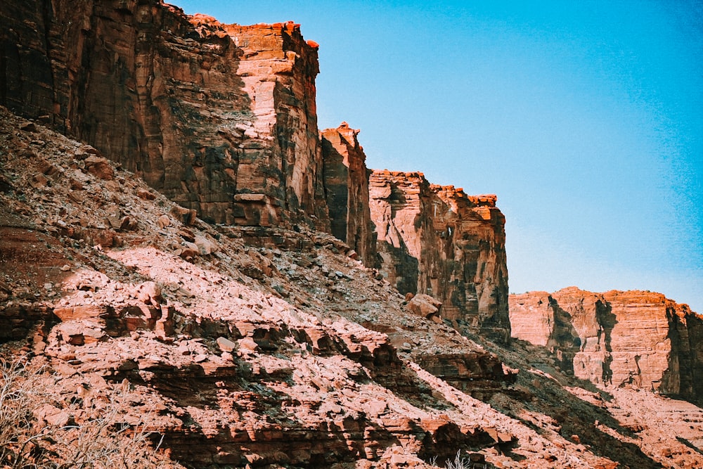 brown rocky mountain under blue sky during daytime