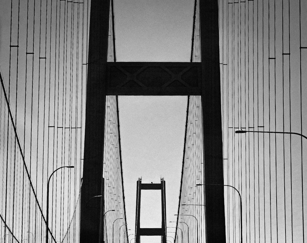 grayscale photo of bridge during daytime