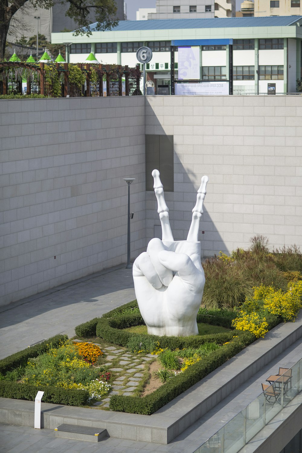 white statue of angel on green grass field