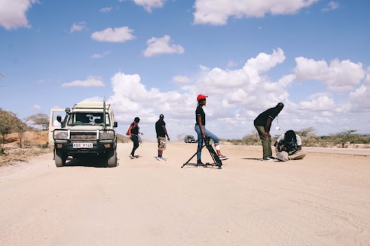 people standing on white sand during daytime in Turkana Kenya