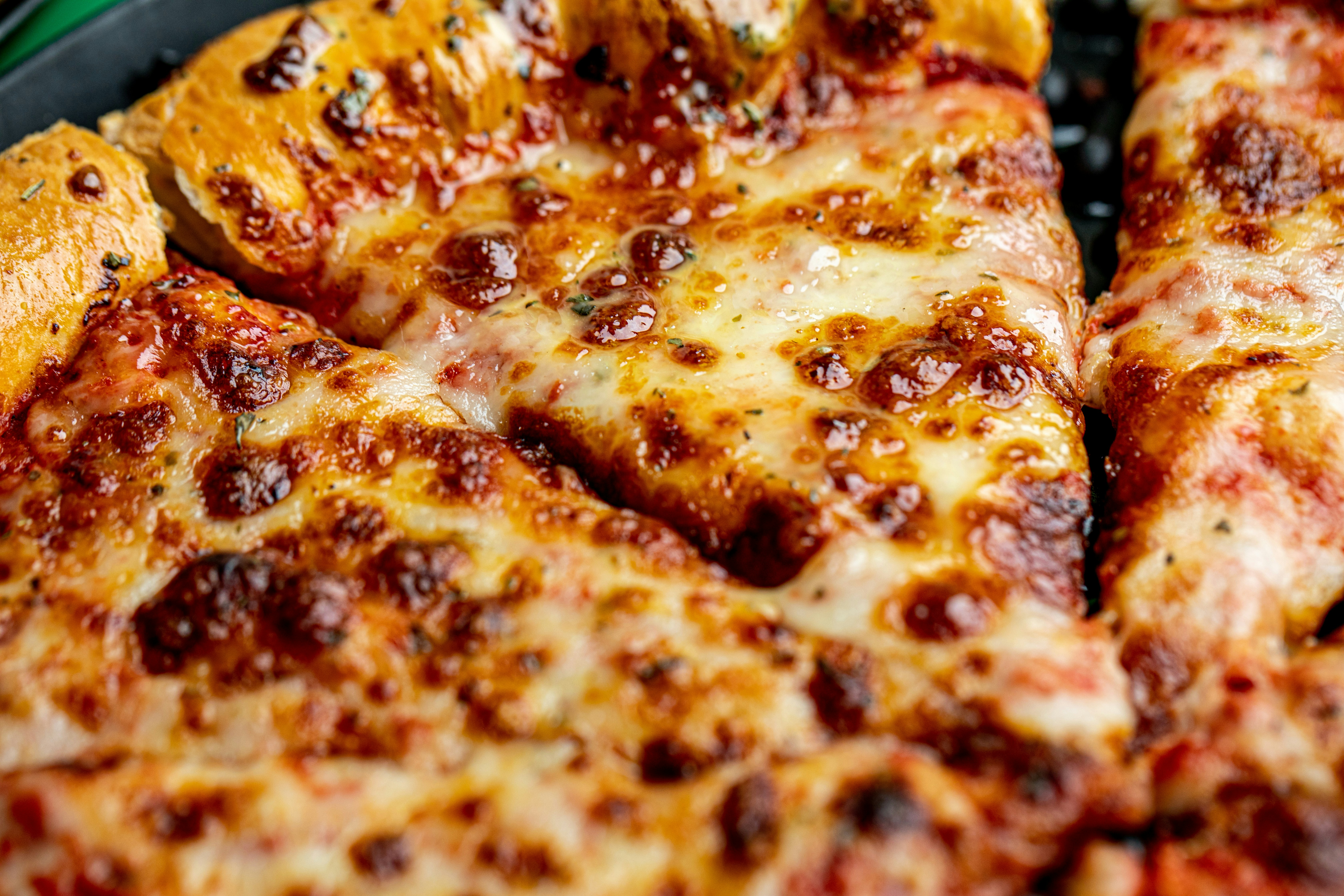 brown and yellow pizza on yellow plate