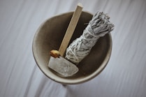 white and black textile on brown round container