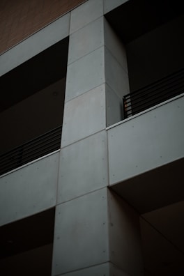 Close-up of sleek concrete pillars with minimalist design elements and golden highlights