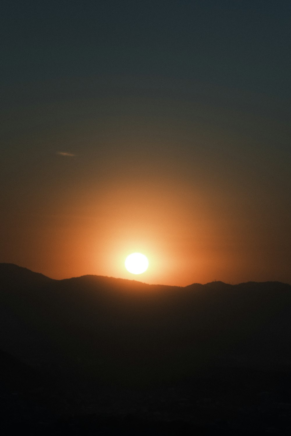 sun setting over the mountains