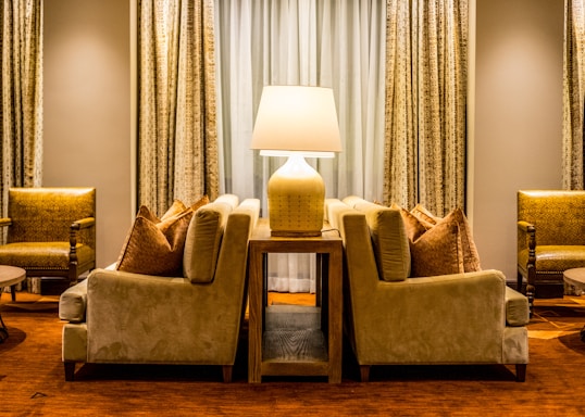 A cozy, elegant living room setup featuring a plush sofa and warm lighting that reflects mb furniture's style.