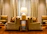 A cozy living room with plush sofas and warm lighting in a luxury apartment.