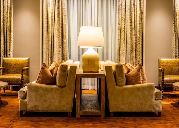 A cozy living room scene featuring elegant cushions and modern lamps from luxordor