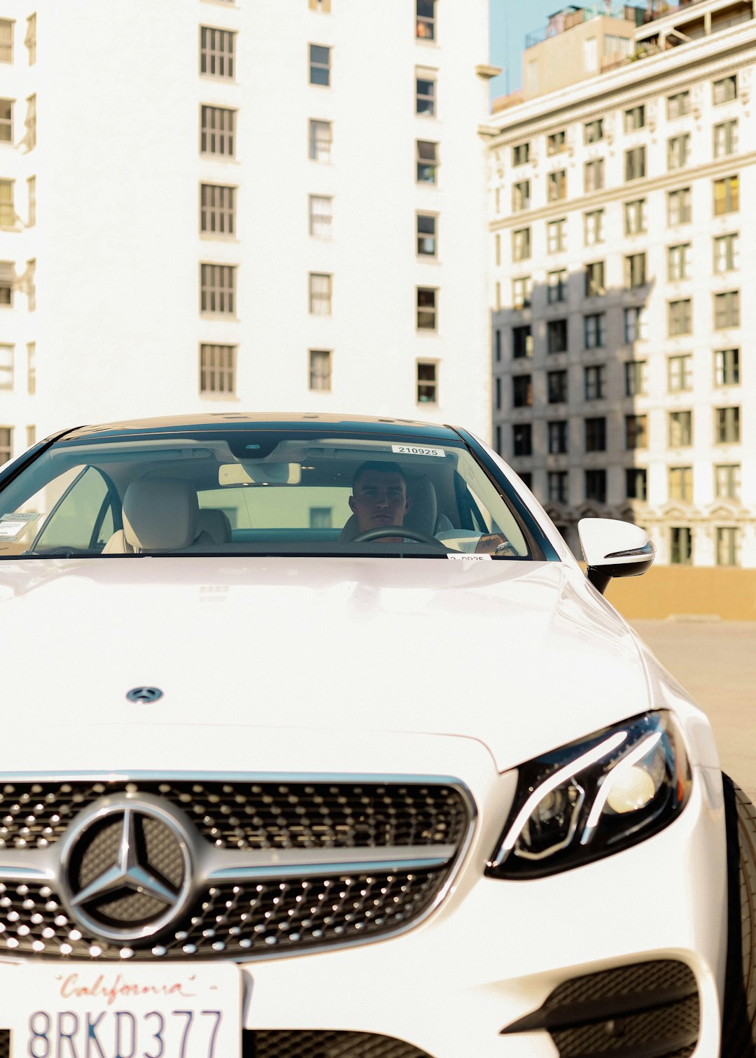 white mercedes benz car on road during daytime