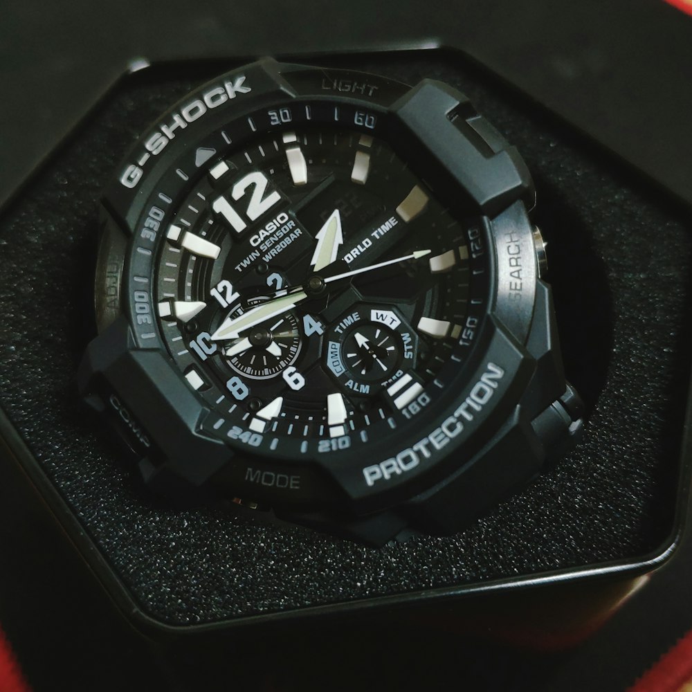 black and silver round chronograph watch