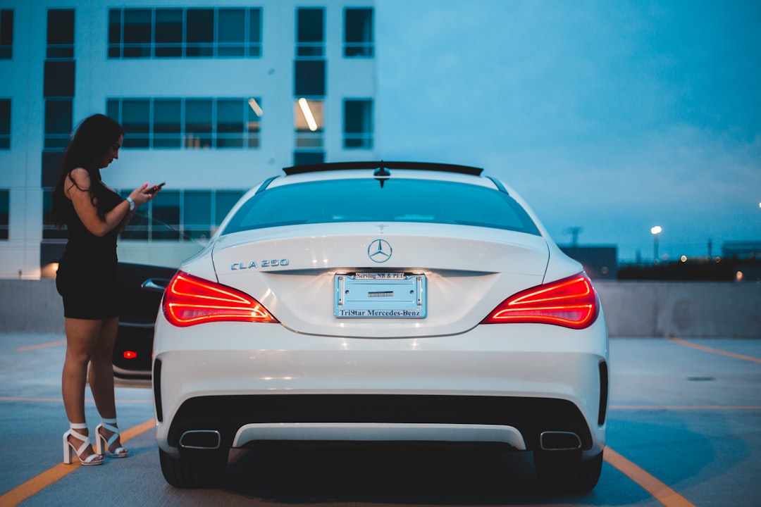 white bmw m 3 parked on parking lot during daytime