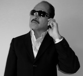 A confident agent negotiating deals over the phone.