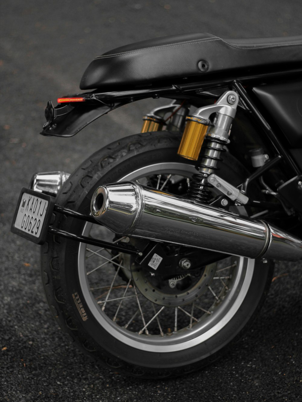 black and silver motorcycle on gray concrete floor