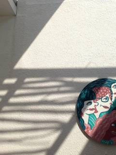 Artistic 3D printed wall art piece with layered patterns and vibrant colors