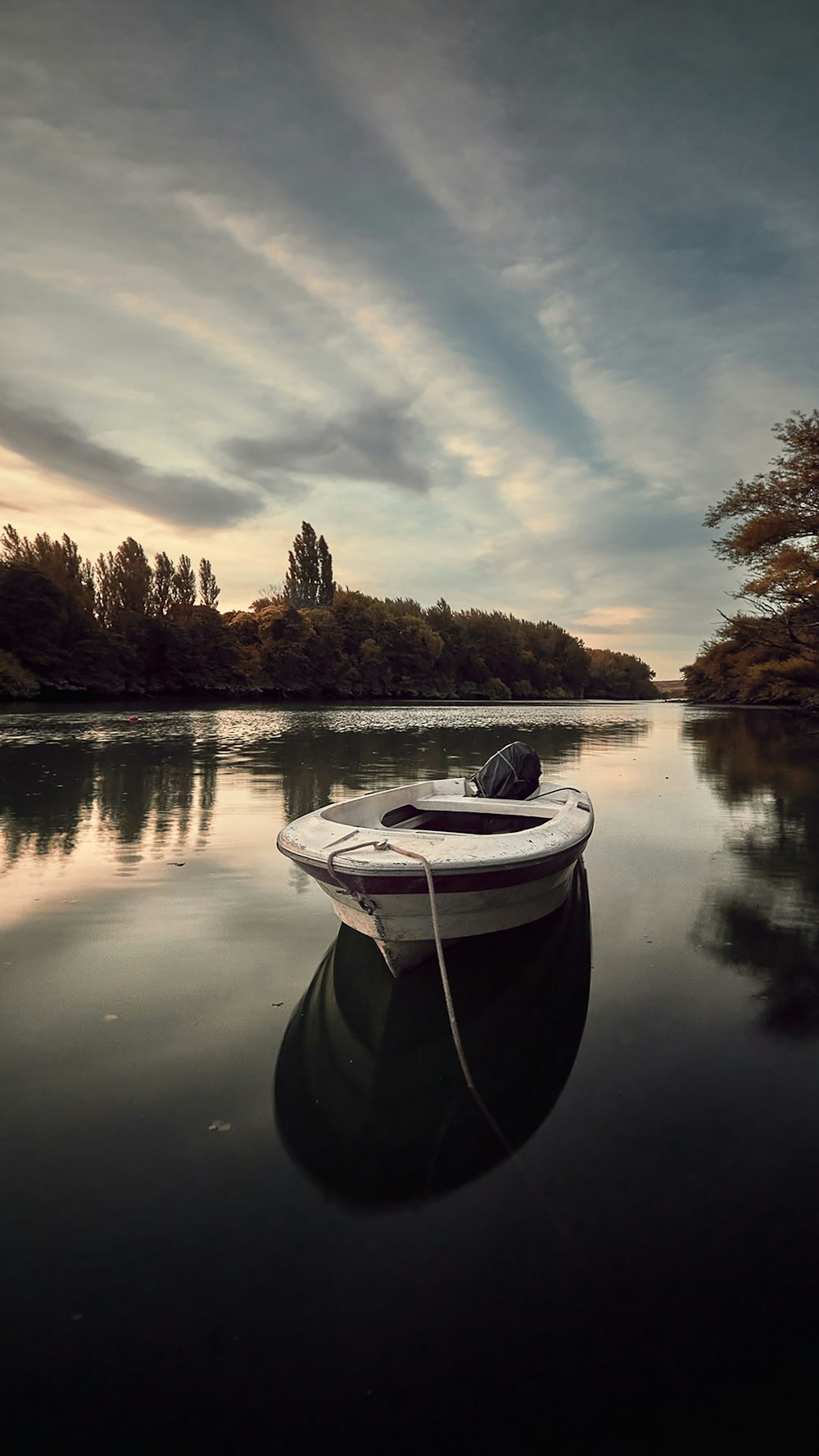 white boat on lake during daytime