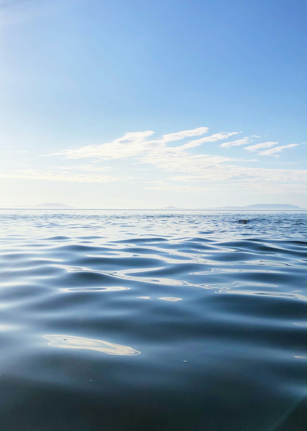 body of water under blue sky during daytime