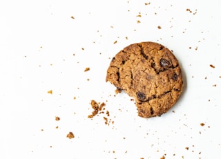 brown round cookie on white surface