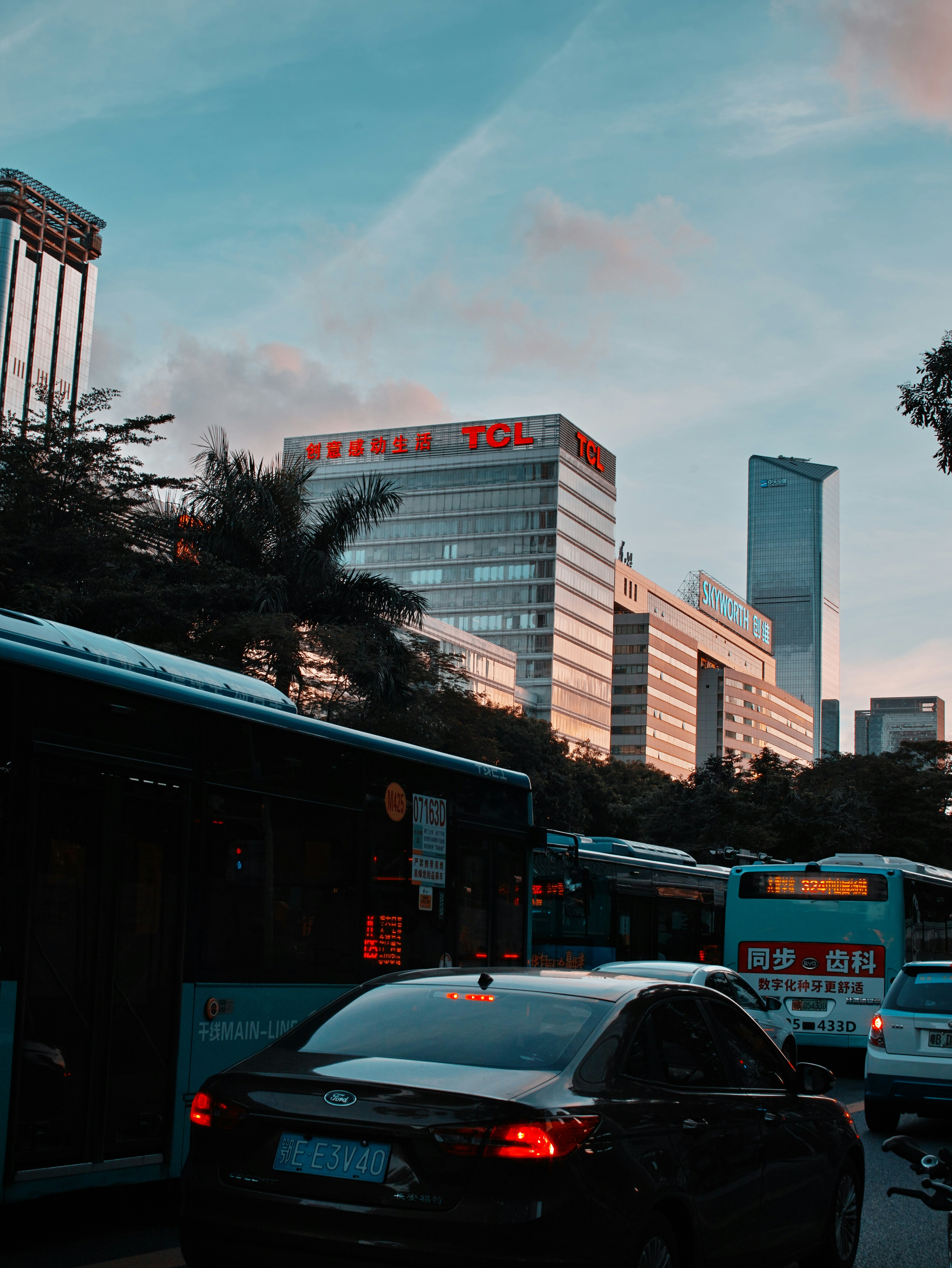 cars parked near high rise buildings during daytime